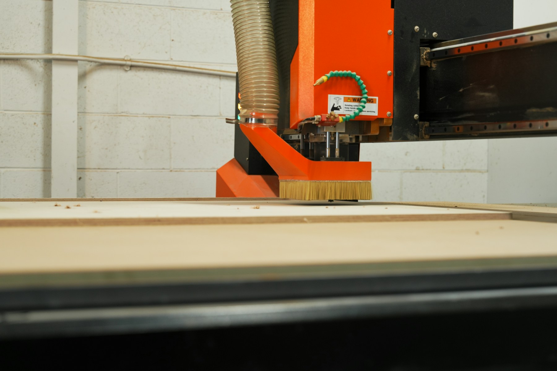 CNC machine cutting a wooden panel